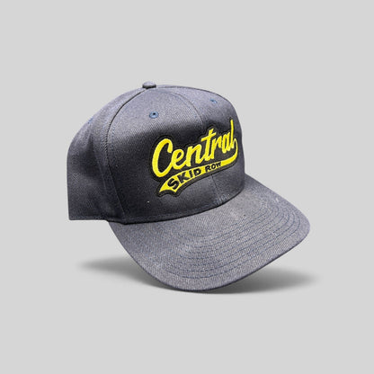 Raree Finds vintage 1990s navy blue denim snapback hat with yellow Central Skid Row embroidered script logo
