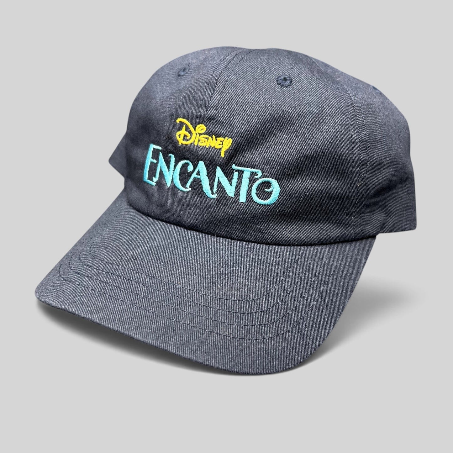 Raree Finds navy blue cotton dad hat with embroidered Disney Encanto logo in gold and teal on the front