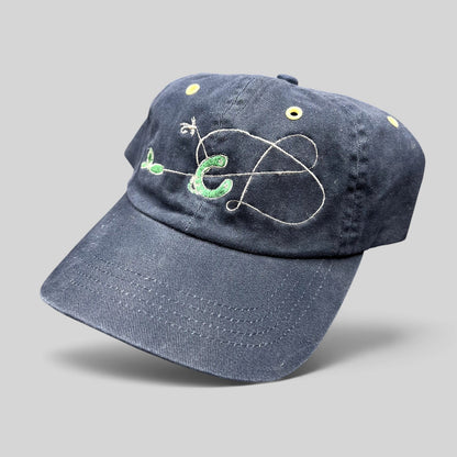 Raree Finds vintage navy cotton strapback hat with embroidered fly fishing lure design and yellow metal eyelets