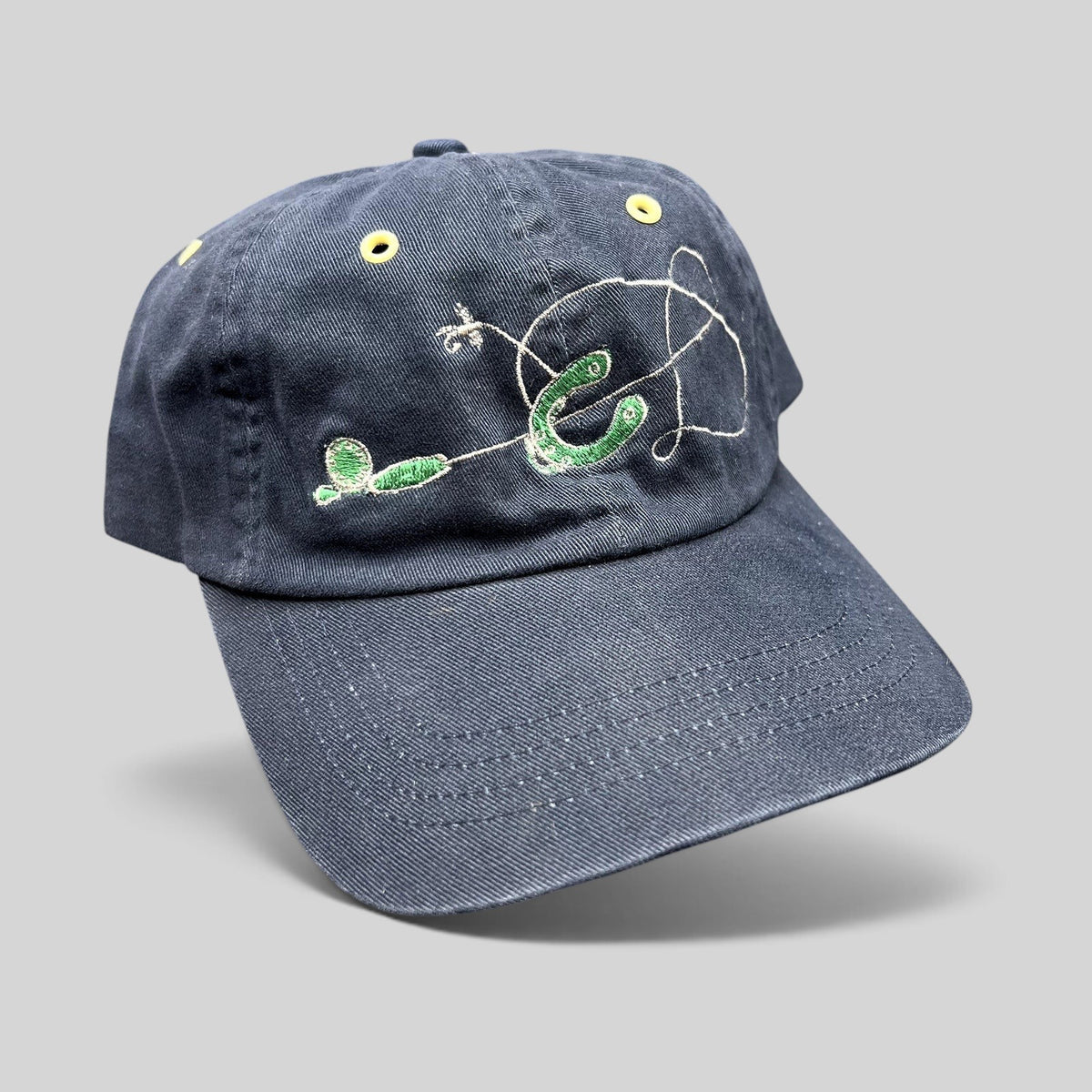 Raree Finds vintage navy cotton strapback hat with embroidered fly fishing lure and hook design