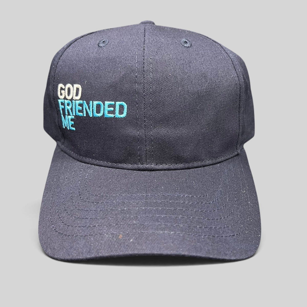 Raree Finds navy blue cotton strapback hat with white and blue God Friended Me embroidery on the front