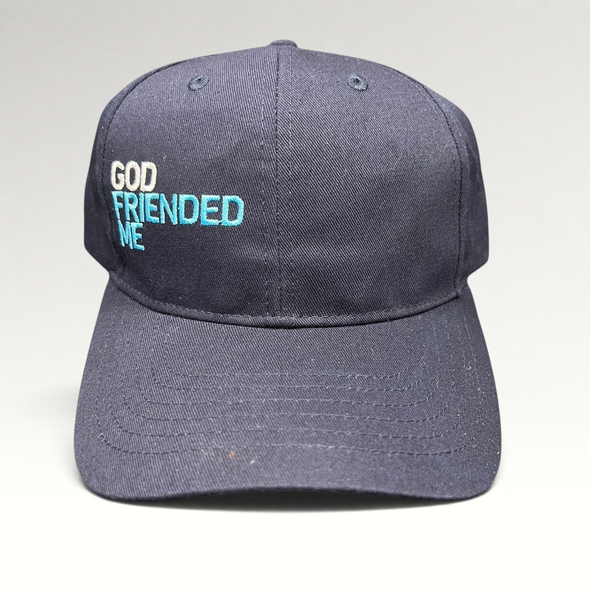 Raree Finds navy blue cotton strapback hat with white and blue God Friended Me embroidery on the front