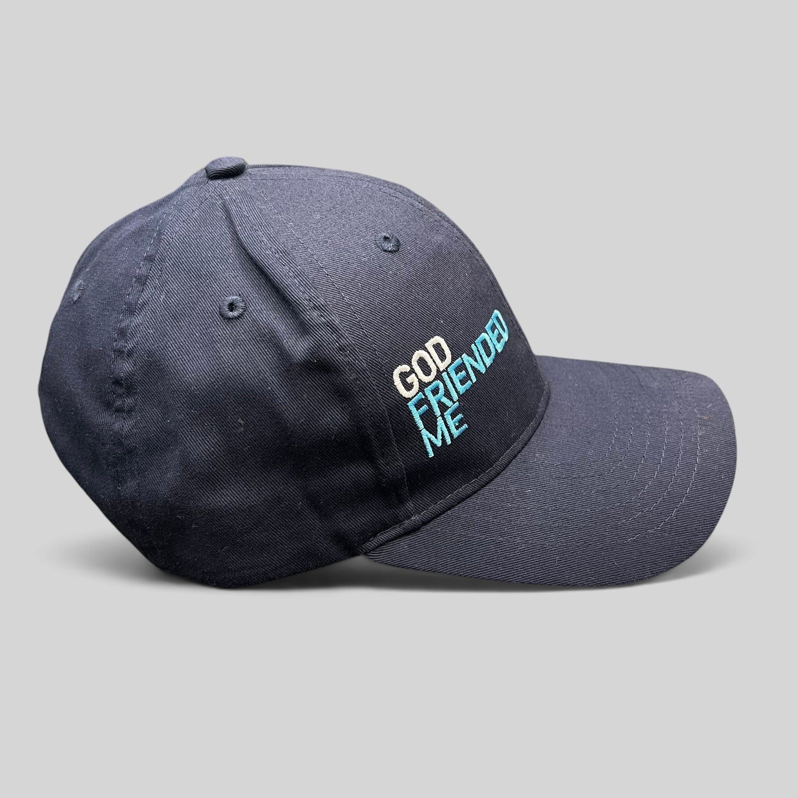 Raree Finds navy blue cotton strapback hat with God Friended Me embroidered logo from the TV show production.