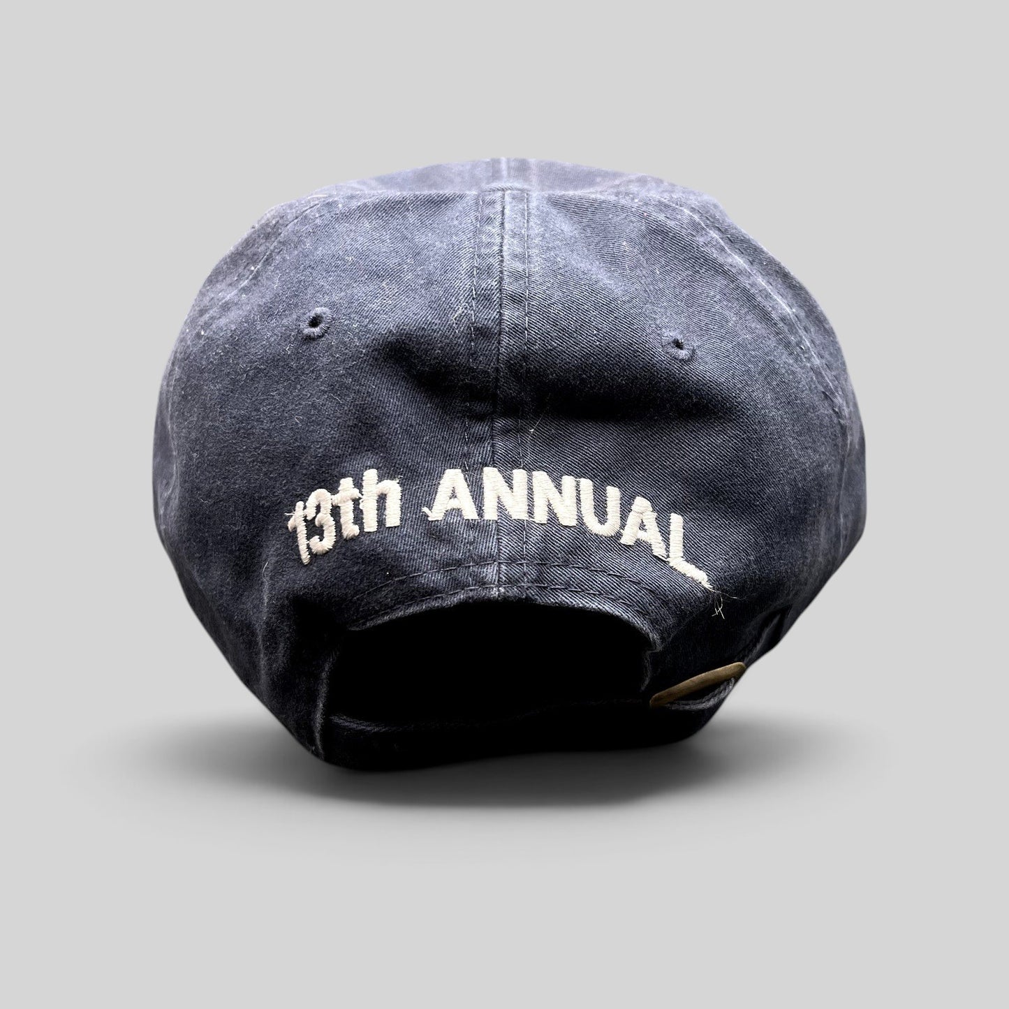 Raree Finds vintage navy blue golf hat with 13th Annual embroidered on the back and adjustable brass buckle strapback.