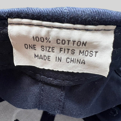 Raree Finds vintage navy hat interior label showing 100 percent cotton, one size fits most, and made in China text.