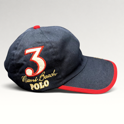 Raree Finds vintage navy blue La Martina cotton strapback hat with red brim piping and Miami Beach Polo embroidery.