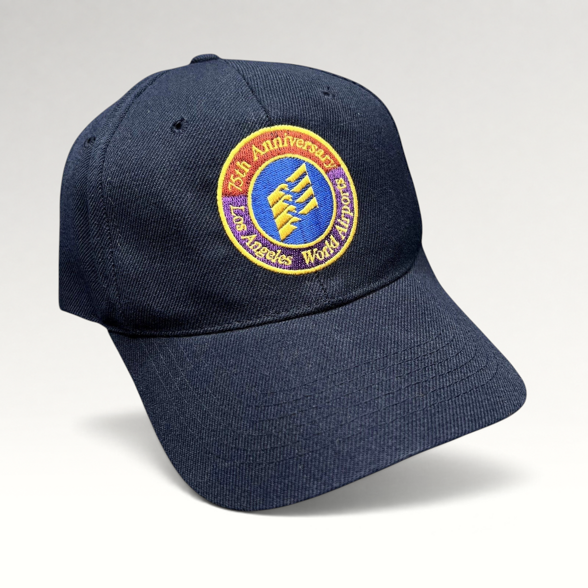 Raree Finds navy blue wool-blend strapback hat with an embroidered 75th Anniversary Los Angeles World Airports logo.