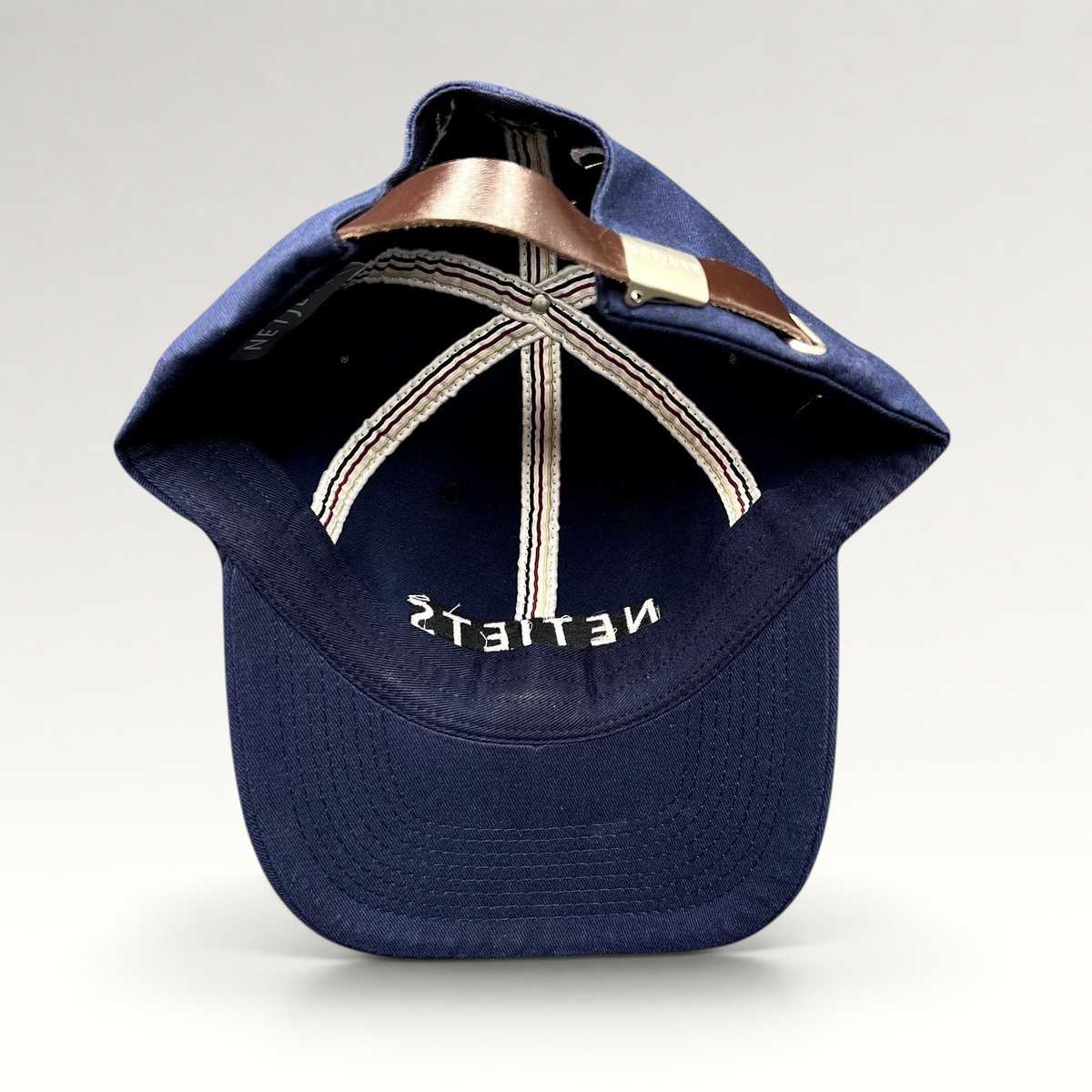Raree Finds navy blue cotton baseball cap with interior NetJets branding and adjustable brown leather strap