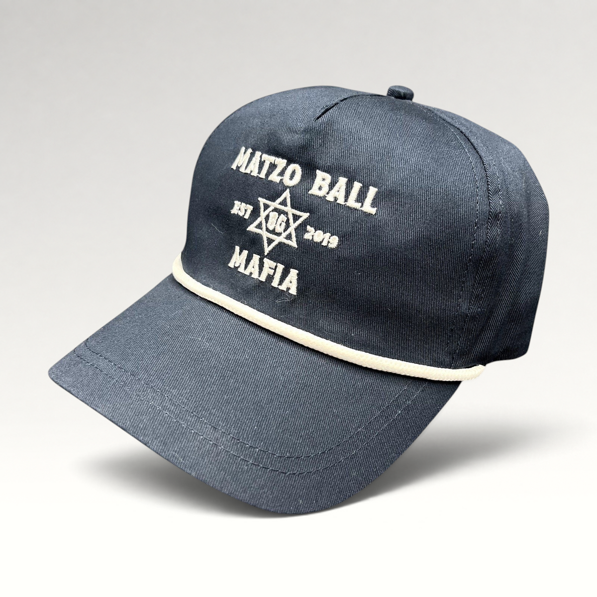 Raree Finds navy blue snapback rope hat with white Matzo Ball Mafia embroidery and Star of David detail.