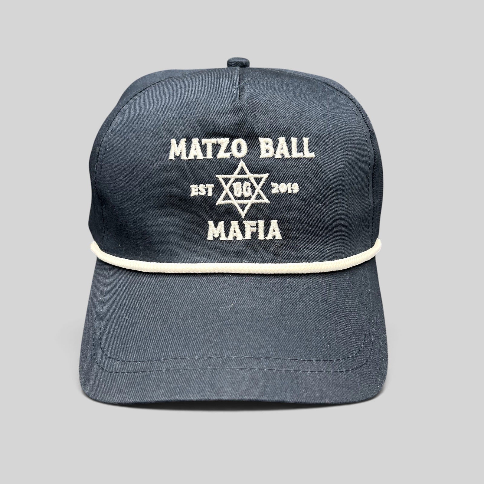 Raree Finds navy blue snapback rope hat with white Matzo Ball Mafia embroidery and Star of David detail.