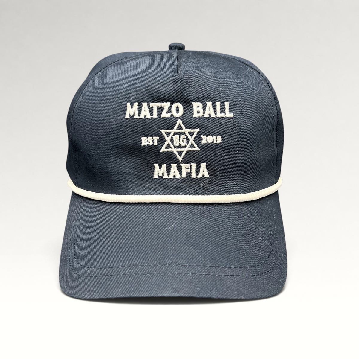 Raree Finds navy blue snapback rope hat with white Matzo Ball Mafia embroidery and Star of David detail.