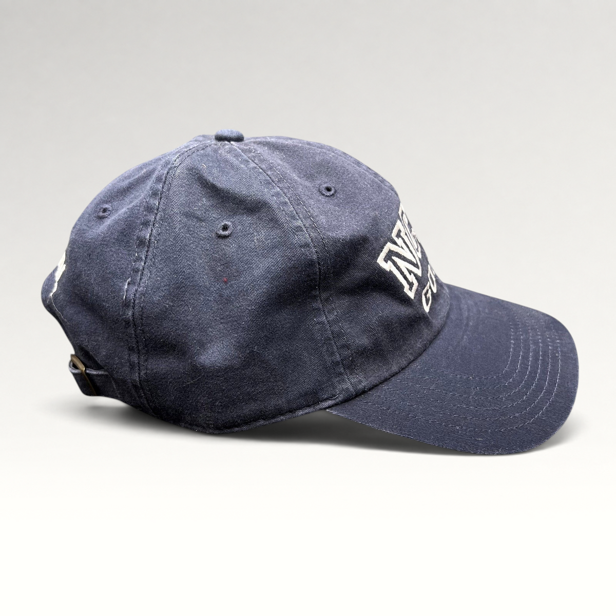 Raree Finds vintage navy blue NCIS Golf tournament strapback hat with embroidered lettering and brass buckle
