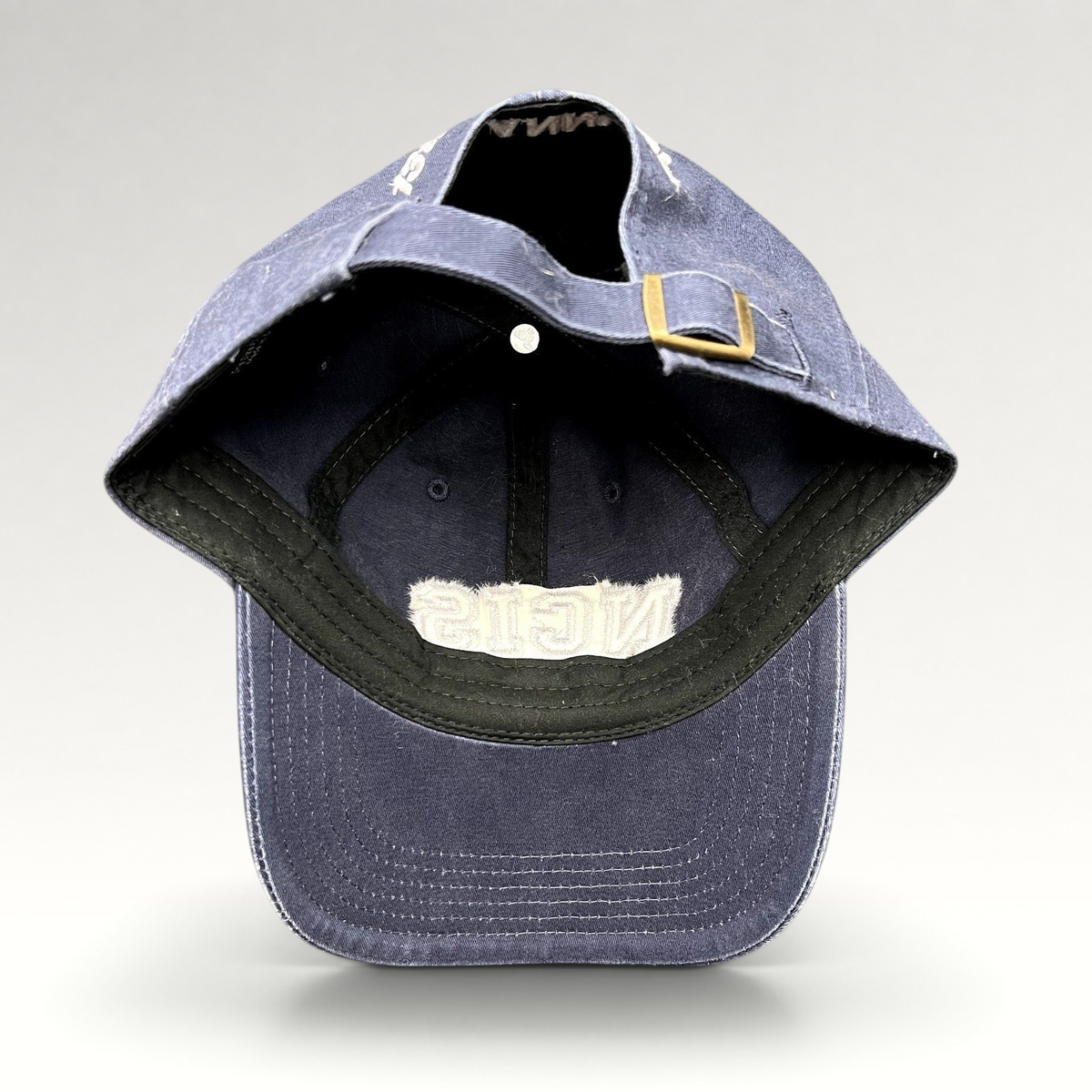 Raree Finds vintage navy blue NCIS golf tournament strapback hat with adjustable brass buckle closure