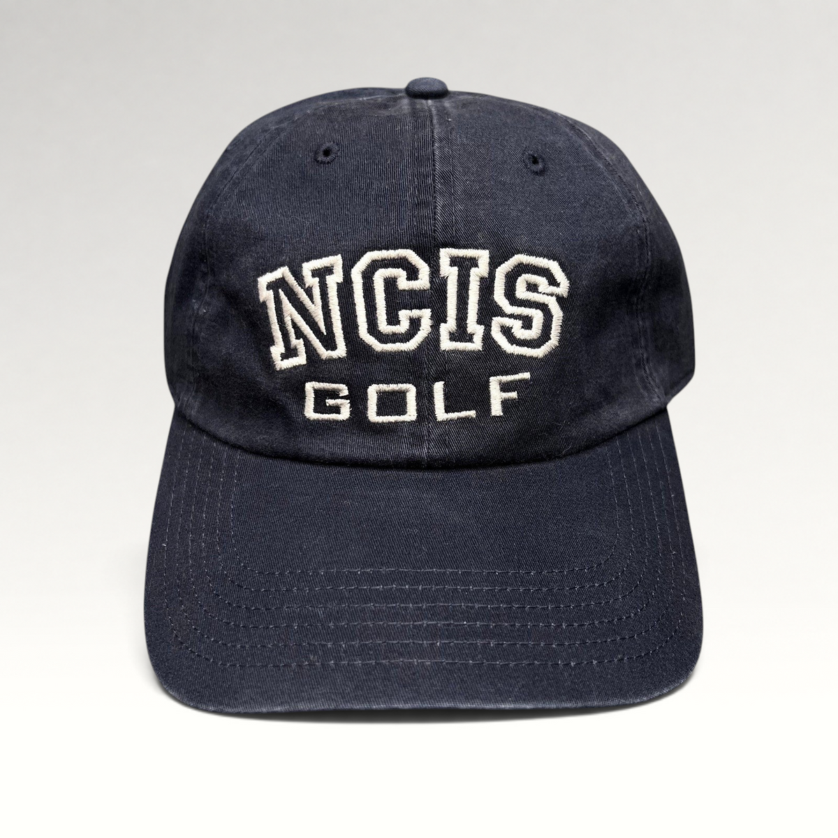 Raree Finds vintage navy blue NCIS Golf tournament strapback hat with white embroidered lettering on the crown.