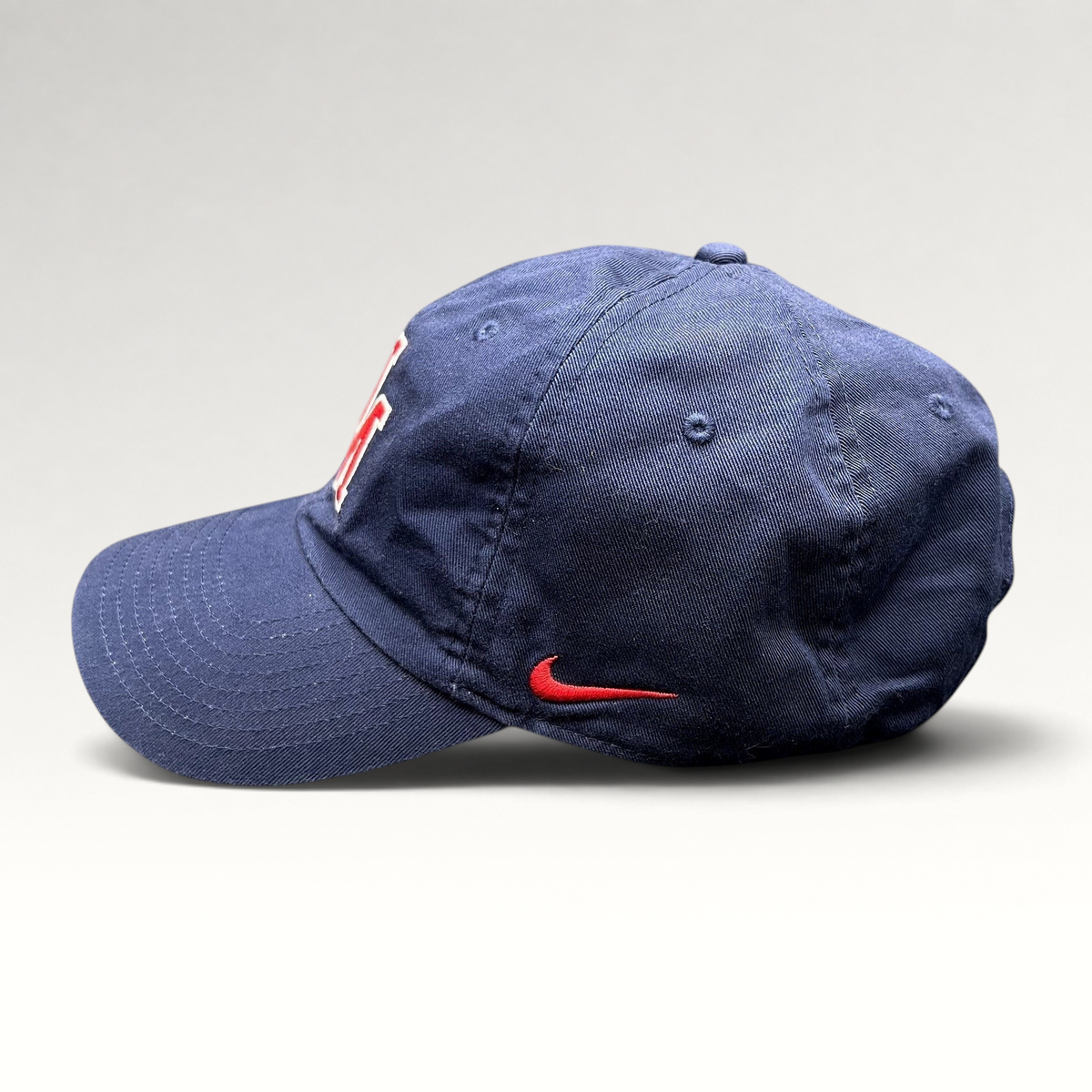 Raree Finds navy blue Nike Heritage86 University of Mobile strapback hat with red side swoosh and curved brim