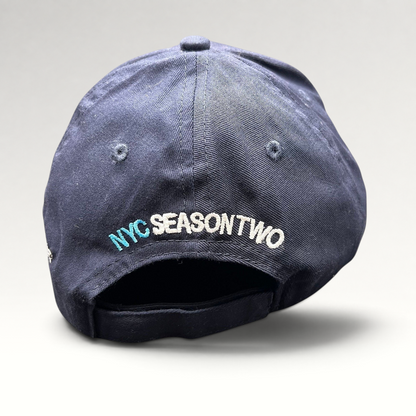Raree Finds navy cotton strapback hat with NYC Season Two embroidery on the back, from God Friended Me production.