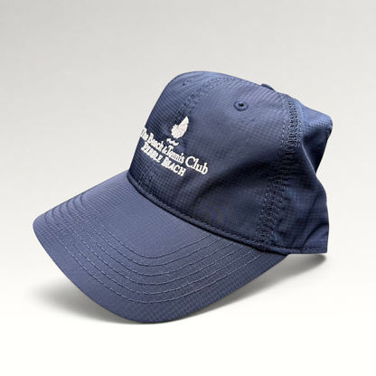 Raree Finds navy performance fabric cap with white embroidered Pebble Beach Beach & Tennis Club logo and curved brim