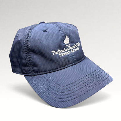 Raree Finds navy performance fabric cap with white embroidered Pebble Beach Beach & Tennis Club logo and curved brim