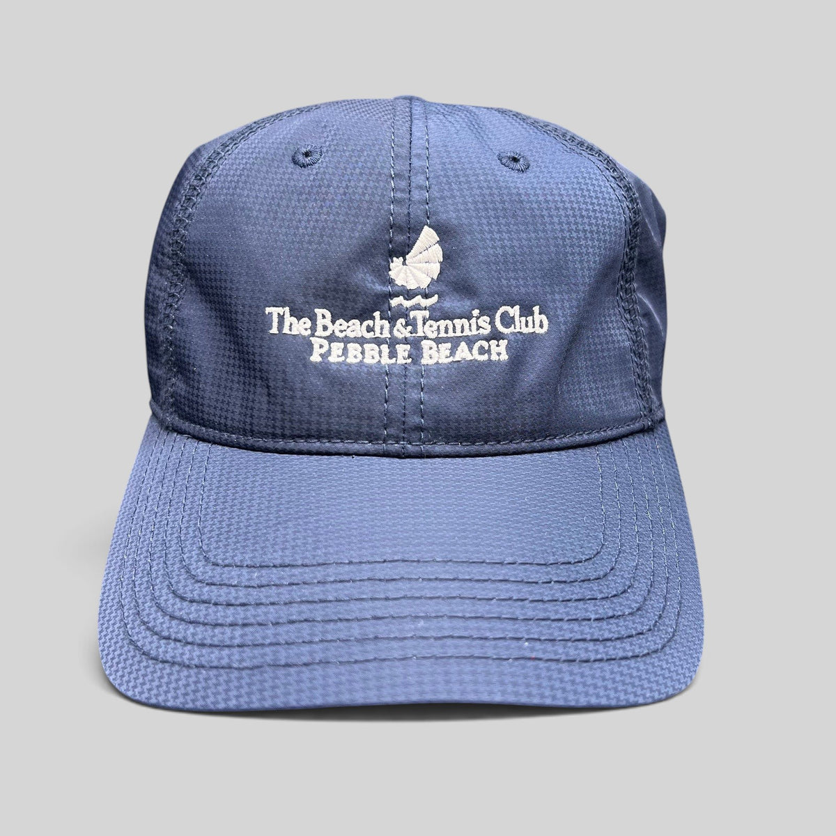 Raree Finds navy performance fabric hat with white Pebble Beach Beach & Tennis Club embroidery and adjustable strapback