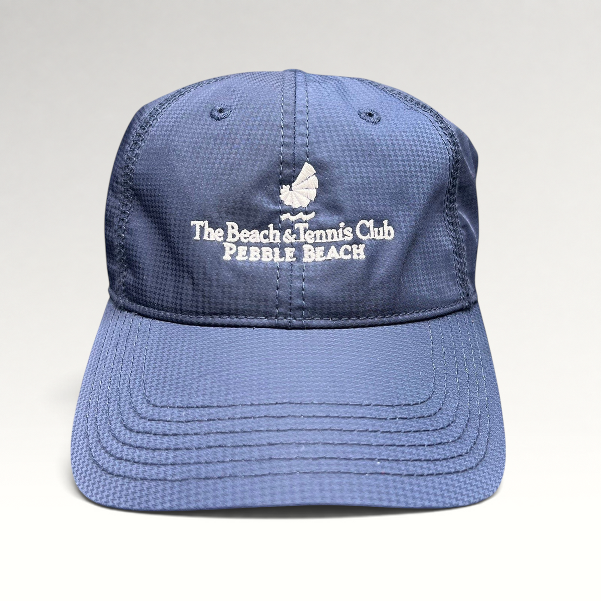 Raree Finds navy performance fabric hat with white Pebble Beach Beach & Tennis Club embroidery and adjustable strapback
