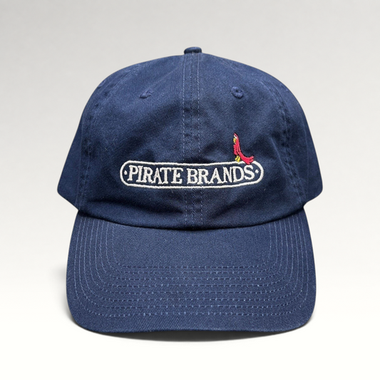 Raree Finds navy cotton dad hat with embroidered Pirate Brands logo and red parrot detail on a curved brim cap