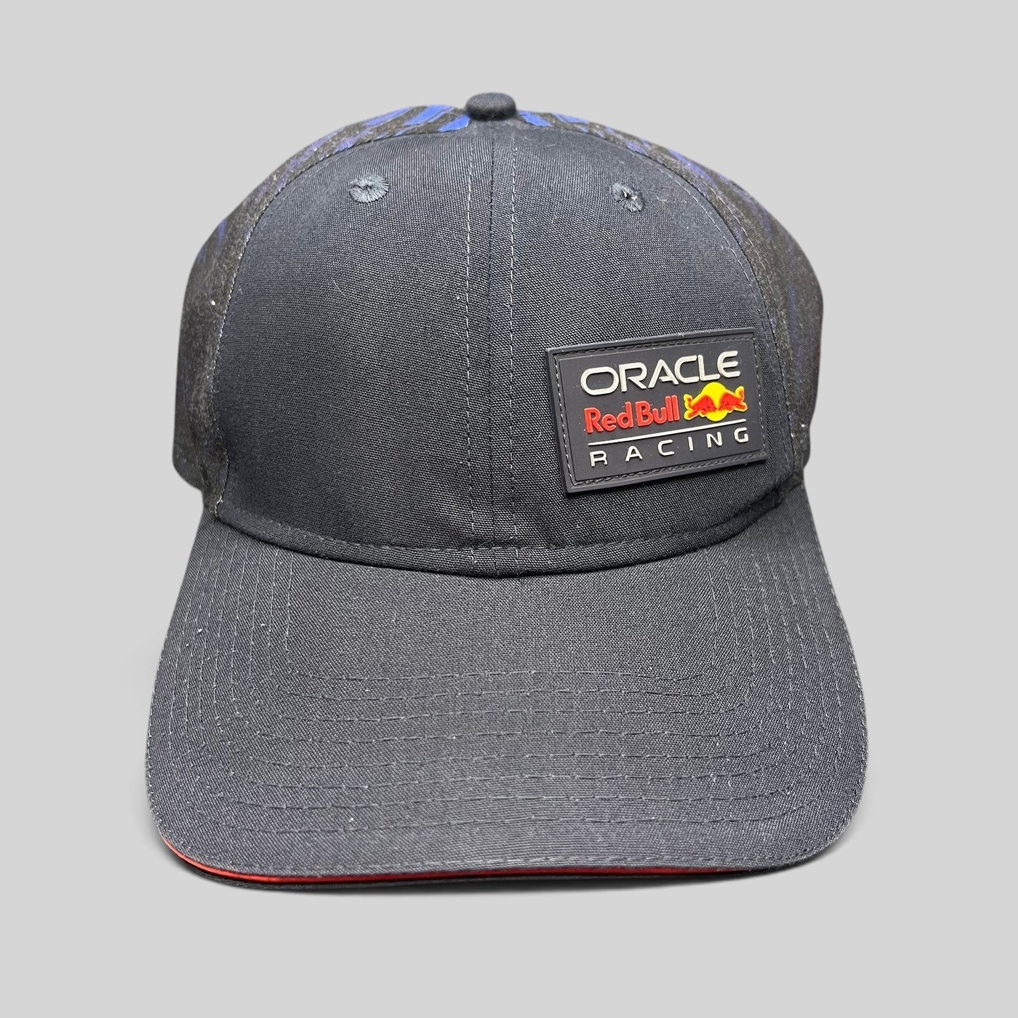 Raree Finds navy Oracle Red Bull Racing New Era 9FORTY snapback cap with a rubberized front logo and red brim trim.