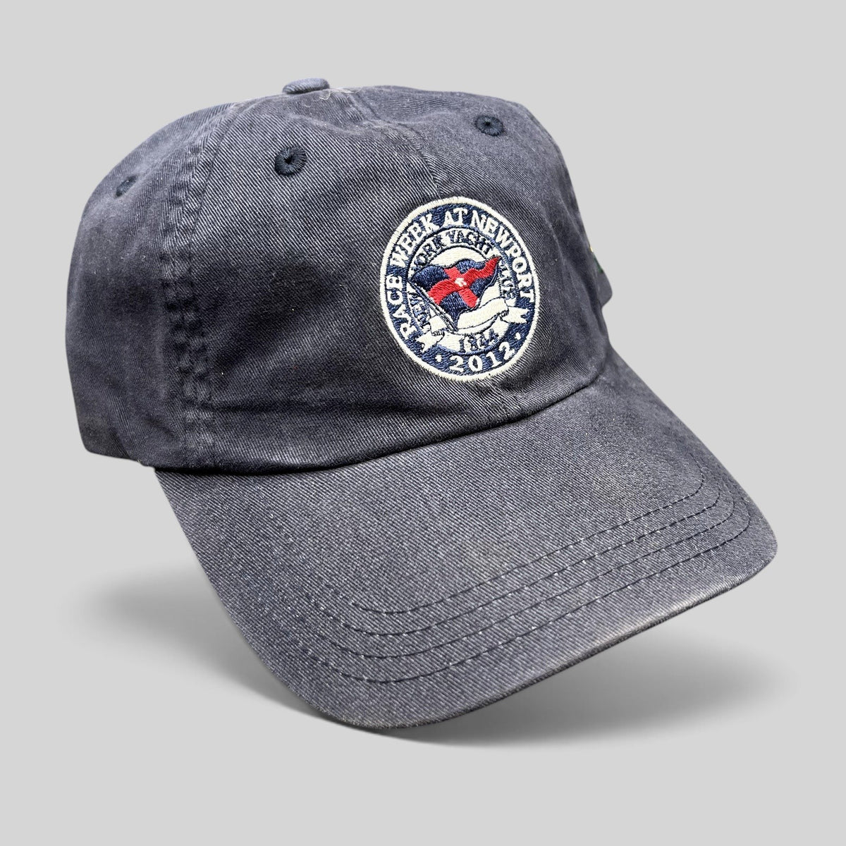 Raree Finds navy blue 2012 Rolex Newport Bermuda Race Week sailing cap with embroidered event crest and strapback.
