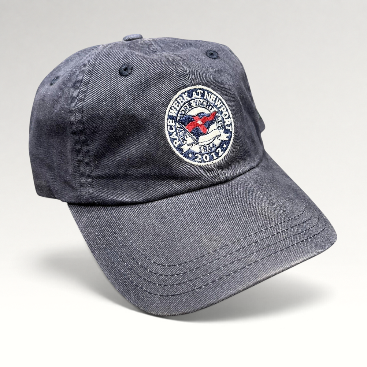 Raree Finds navy blue 2012 Rolex Newport Bermuda Race Week sailing cap with embroidered event crest and strapback.