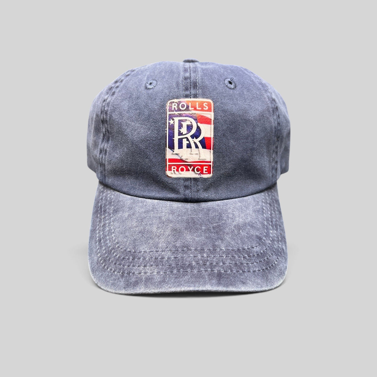 Raree Finds navy washed cotton dad hat with a patriotic Rolls-Royce USA crest patch and pre-curved brim.