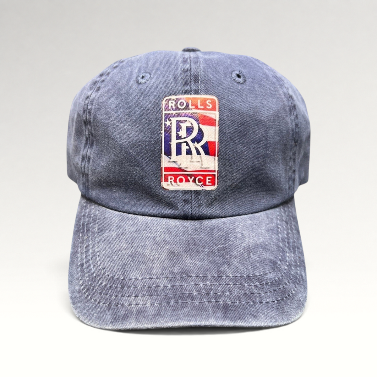 Raree Finds navy washed cotton dad hat with a patriotic Rolls-Royce USA crest patch and pre-curved brim.