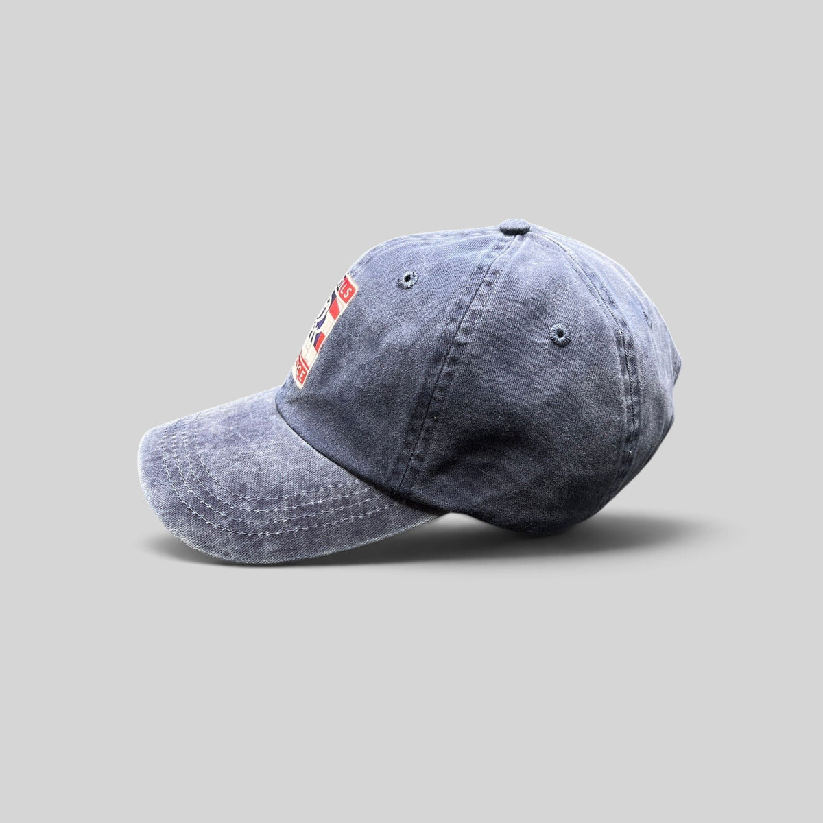 Raree Finds navy washed cotton dad hat with a patriotic Rolls-Royce USA crest patch and pre-curved brim