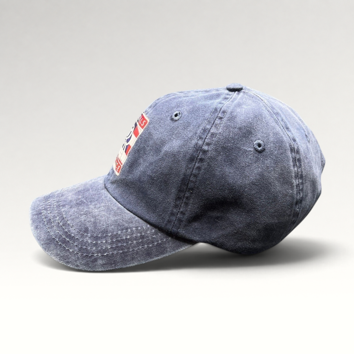 Raree Finds navy washed cotton dad hat with a patriotic Rolls-Royce USA crest patch and pre-curved brim