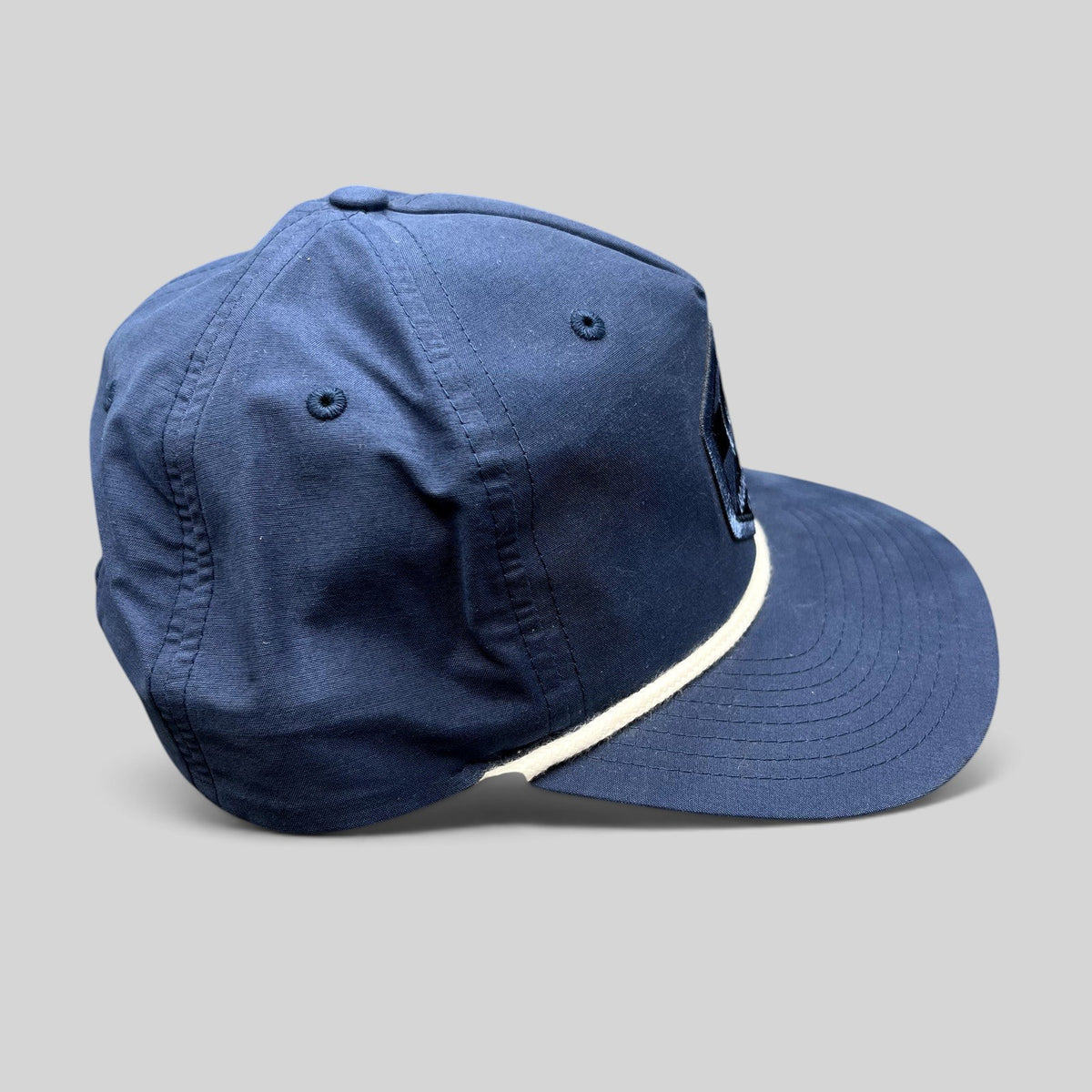 Raree Finds navy blue Boondoggle Vail Richardson Outdoor snapback hat with white rope detail and mountain logo patch