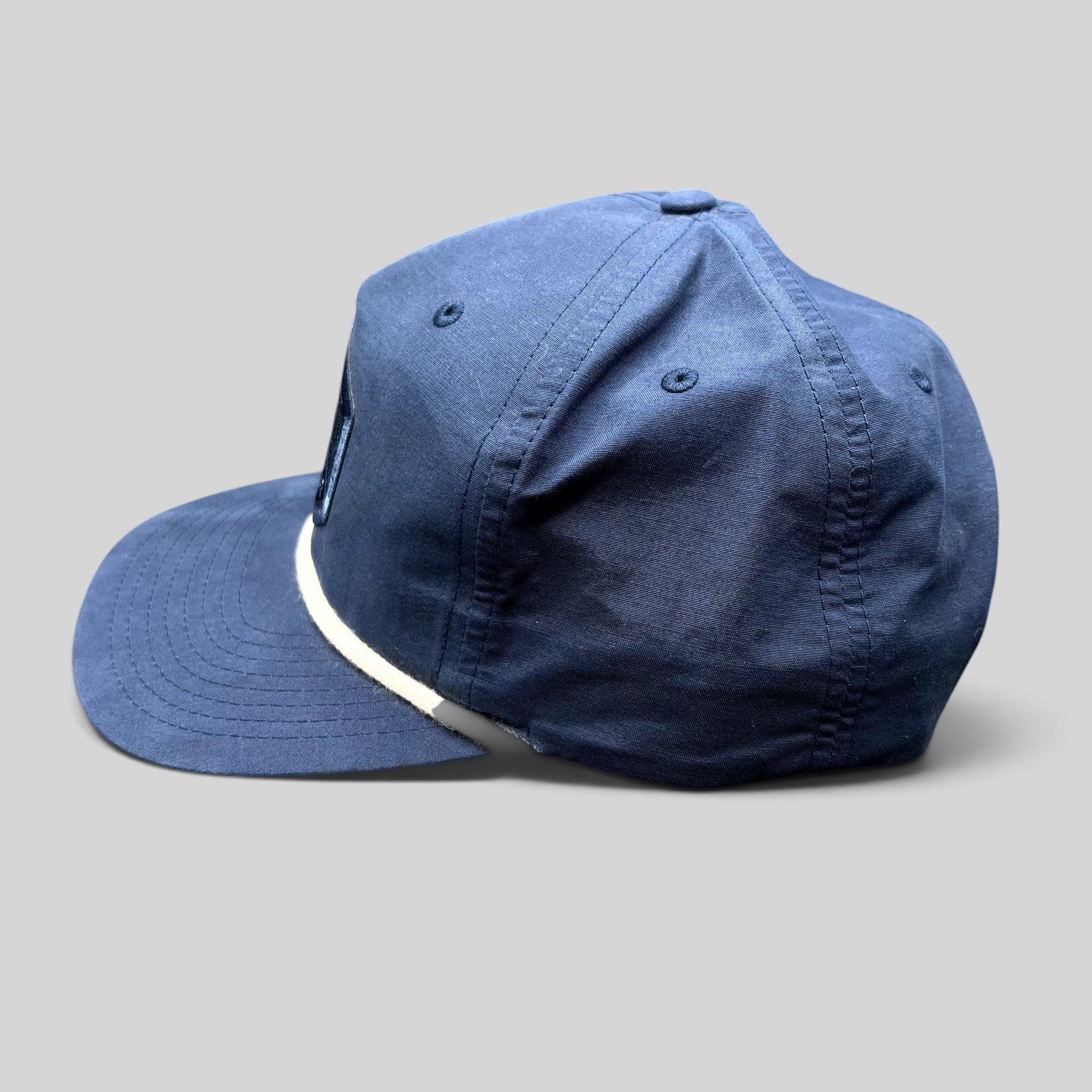 Raree Finds navy blue Richardson Outdoor snapback hat with white rope detail and mountain logo patch