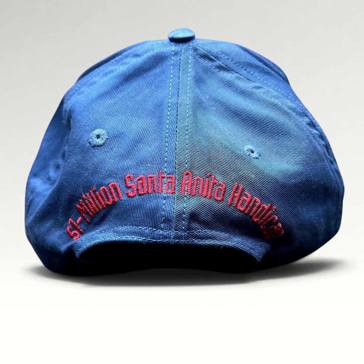 Raree Finds vintage navy snapback hat with red embroidered Santa Anita Handicap text on the back