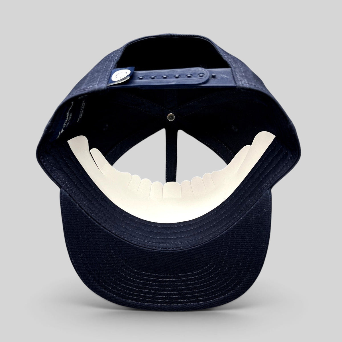 Raree Finds navy blue Quixote Studios snapback hat with adjustable plastic snap closure and flat brim