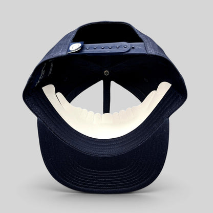 Raree Finds navy blue Quixote Studios snapback hat with adjustable plastic snap closure and flat brim