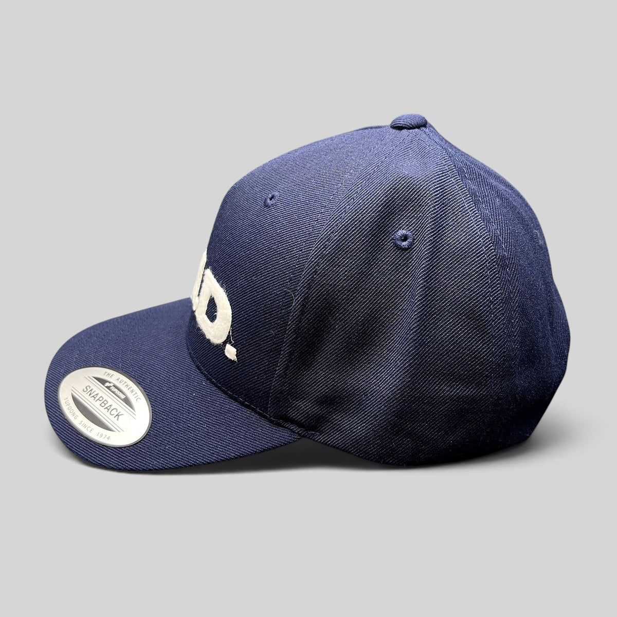 Raree Finds navy blue Yupoong Classics snapback hat with white felt E.N.D. lettering on the structured crown.