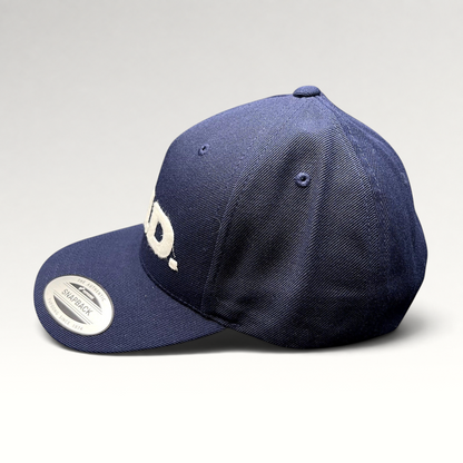Raree Finds navy blue Yupoong Classics snapback hat with white felt E.N.D. lettering on the structured crown.