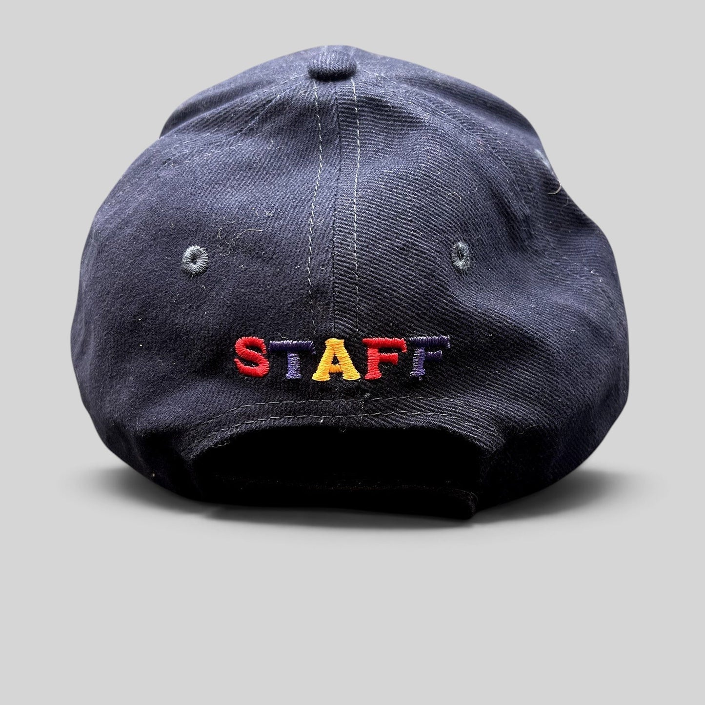 Raree Finds vintage navy blue Telluride Film Festival staff hat with colorful embroidered STAFF text on the back