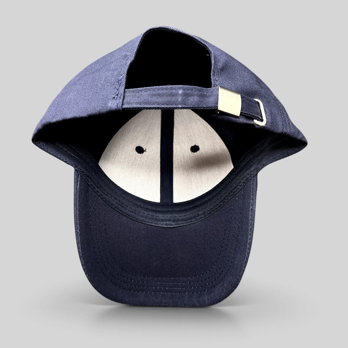 Raree Finds navy blue strapback dad cap with adjustable metal buckle closure and six-panel construction