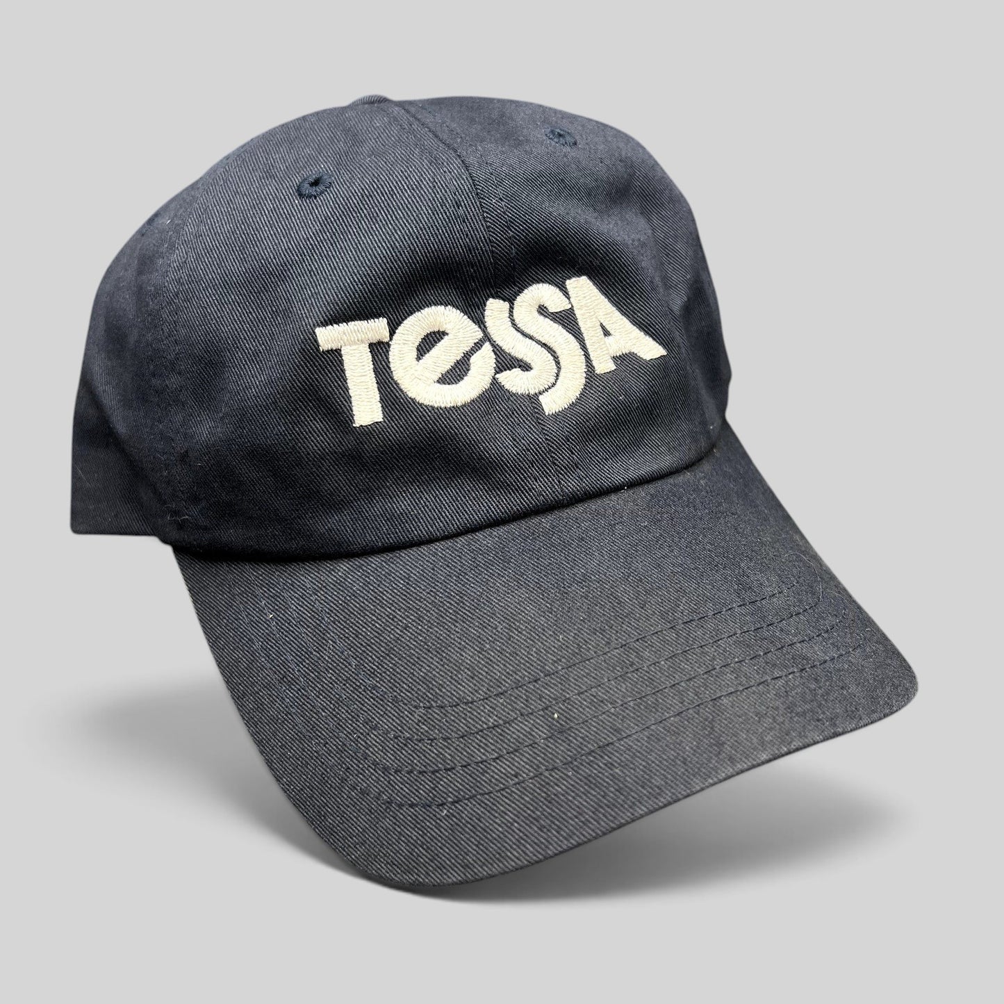 Raree Finds navy blue Yupoong Classics dad cap with white embroidered Tessa logo on the front