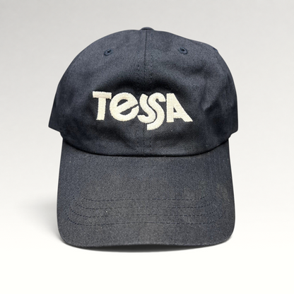 Raree Finds navy blue cotton dad cap with white embroidered Tessa logo and adjustable strapback closure
