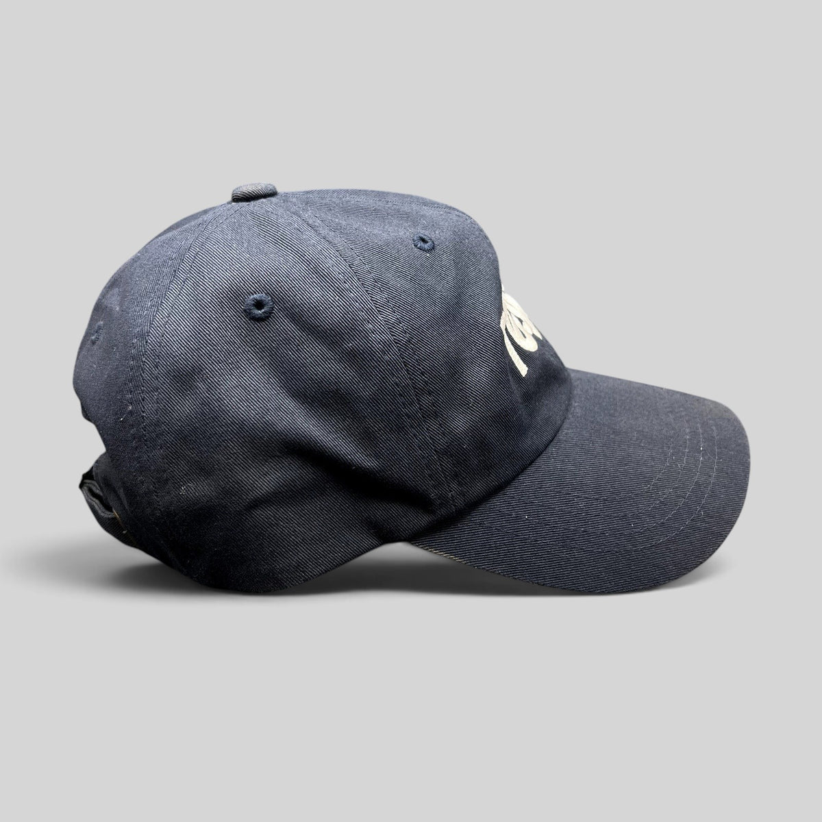 Raree Finds navy blue Tessa dad cap with white embroidered logo and adjustable brass buckle strapback closure