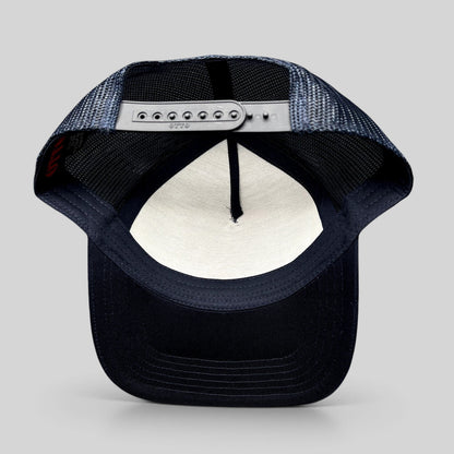 Raree Finds navy blue Otto trucker hat with mesh back panels and adjustable snapback closure, interior view.