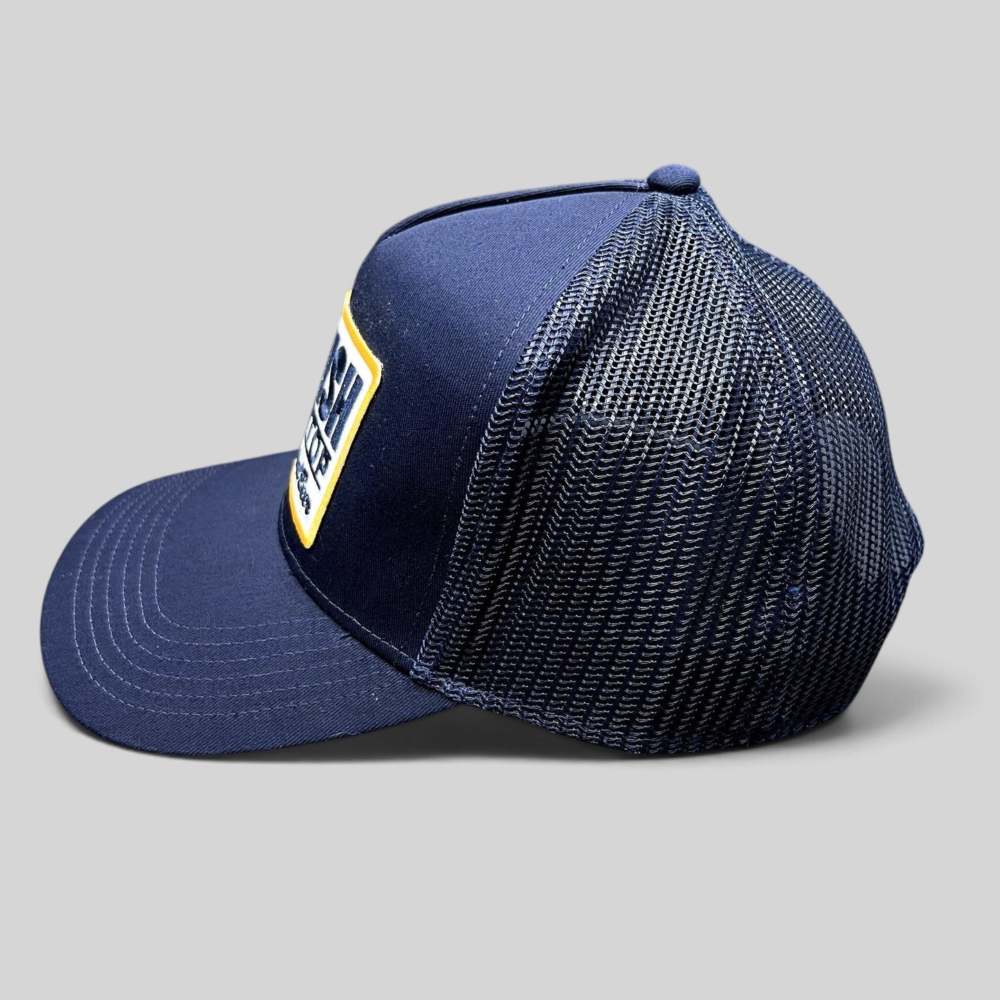 Raree Finds navy blue Otto trucker hat with mesh back and vintage Ice Cold Natural Beer embroidered patch side view