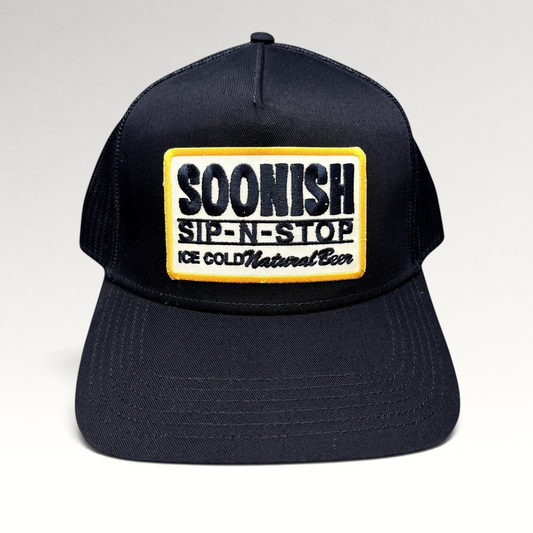 Raree Finds navy blue Otto trucker hat with a vintage-style embroidered Sip-N-Stop Ice Cold Natural Beer patch.