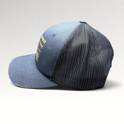Raree Finds navy blue East End Studios trucker snapback hat with mesh back and embroidered logo, side profile view.