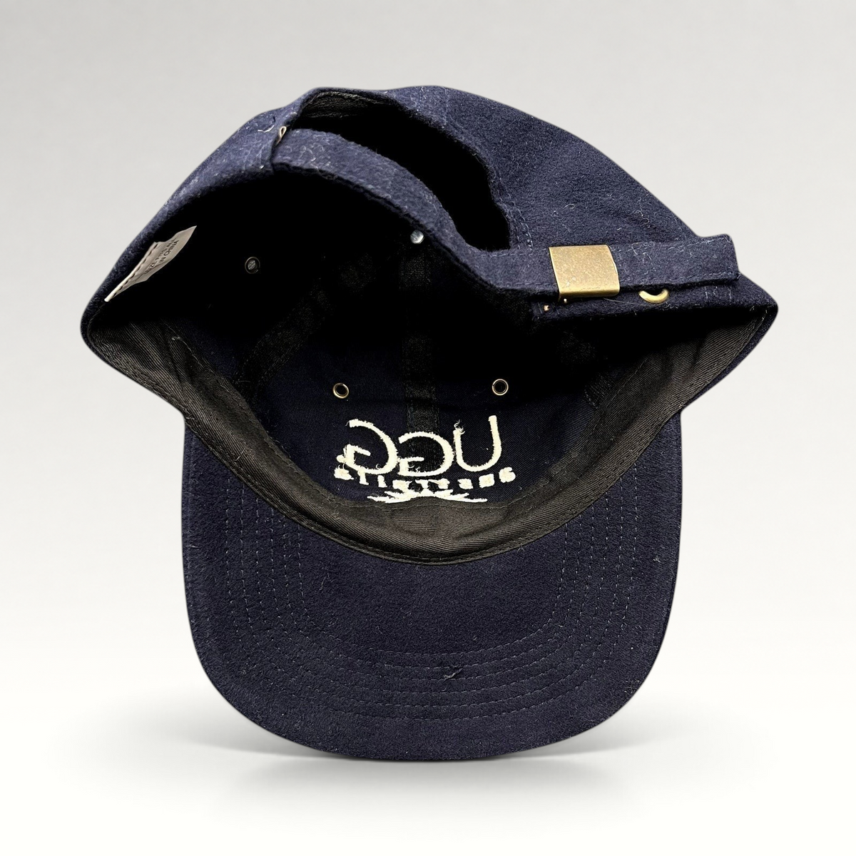 Raree Finds vintage navy blue UGG Australia cotton strapback hat with brass buckle and embroidered logo