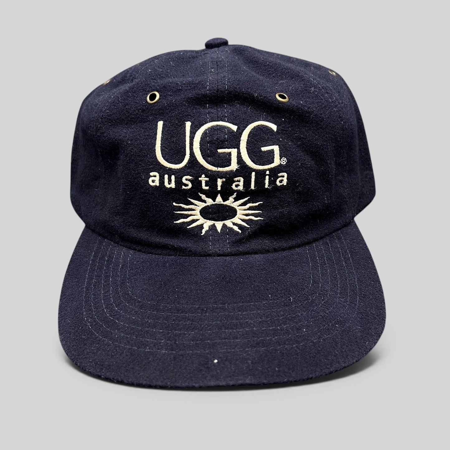 Raree Finds vintage navy blue cotton UGG Australia strapback hat with embroidered logo and sunburst graphic